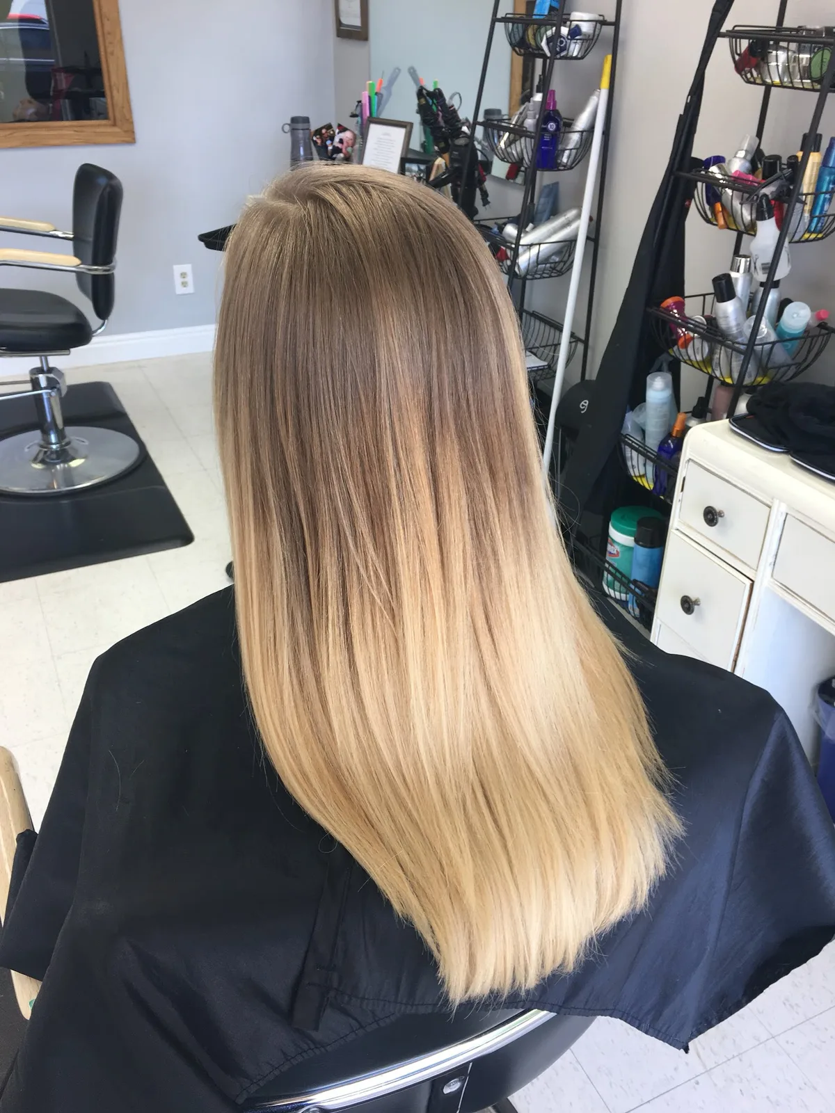 Long, straight blonde hair seen from behind