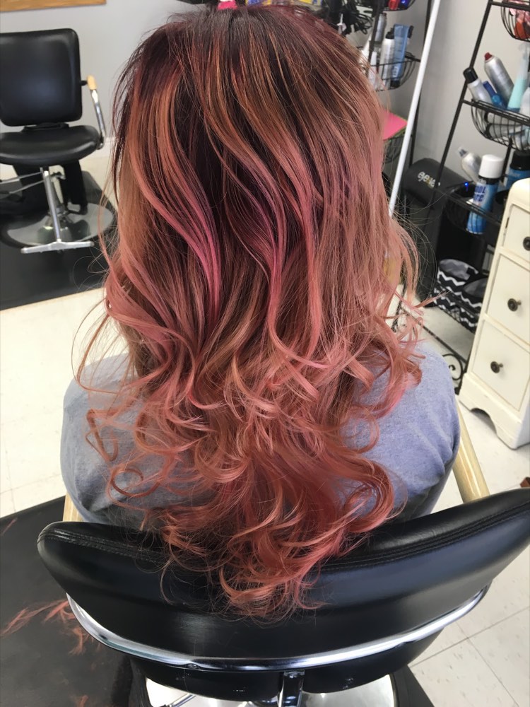 Long rose copper hair in the salon chair at Teased